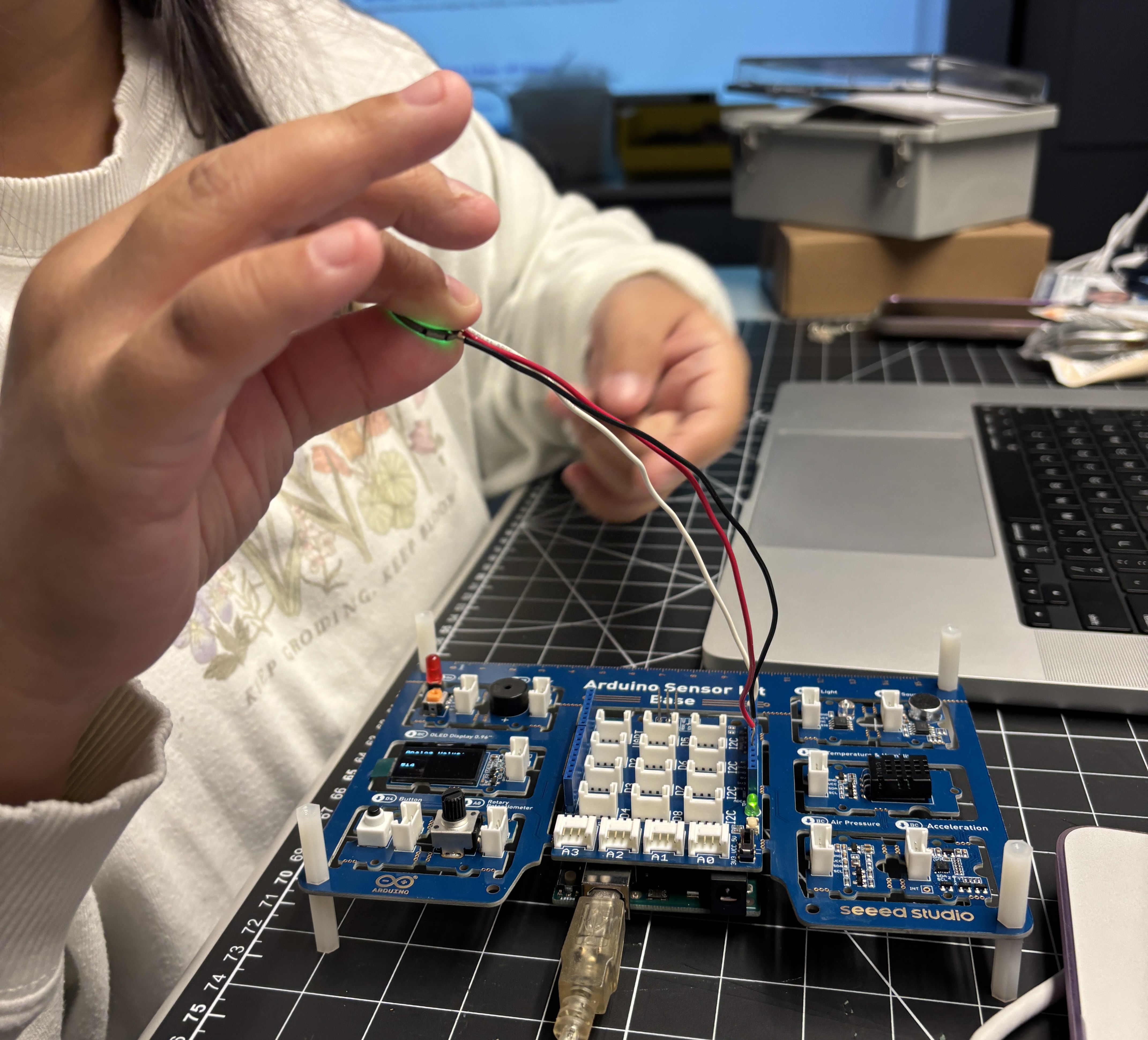 Before we watched coding tutorials, we had to learn first exactly how our pulse sensor worked, as we were completely unfamiliar with it. <br><br> The HW-827 heart rate sensor works by shining a green light onto a thin part of our body, such as a fingertip or earlobe. This light then travels through the skin where some light is absorbed by the blood, and the rest is reflected back. The amount of light bounced back is then measured by measuring the changes in blood volume.