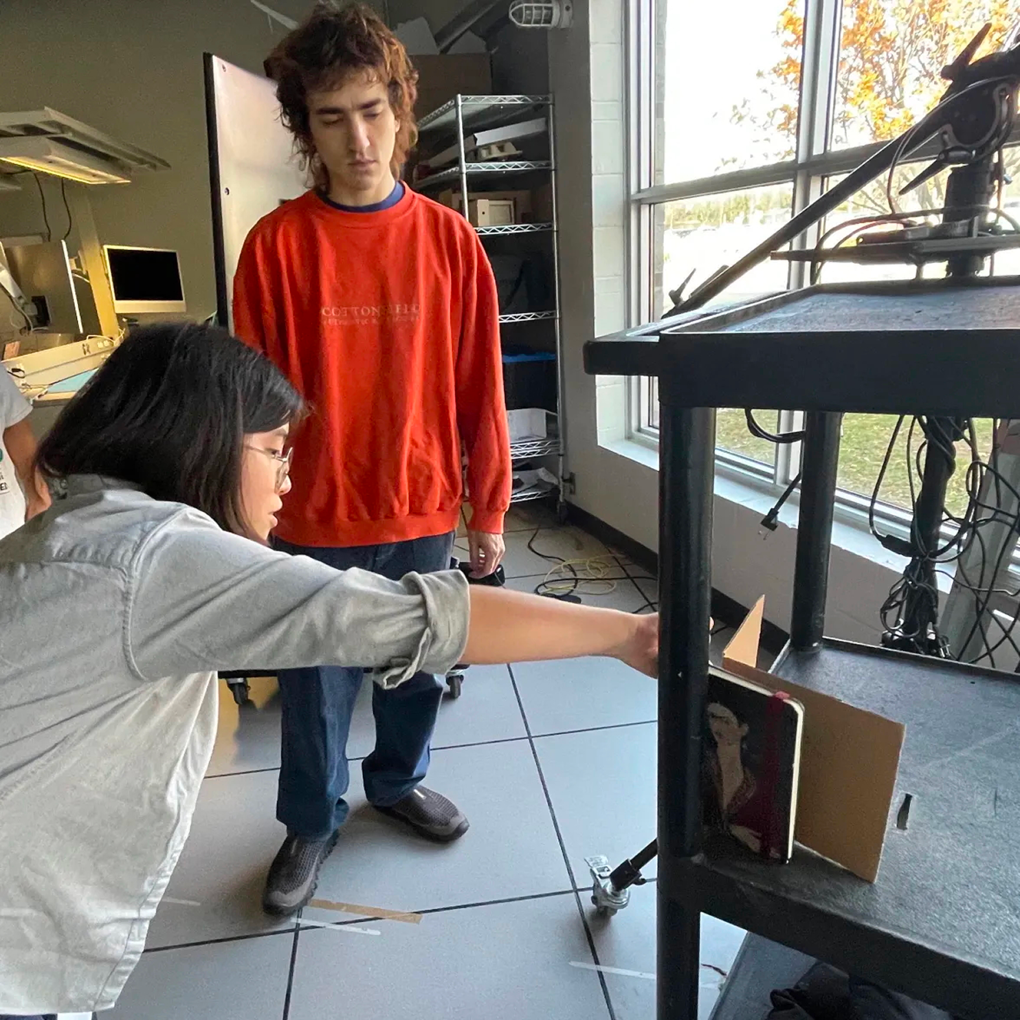 Helping out the patron. This is only the first of different re-enactments we did to discover the best possible way to streamline the process of finding a specific resource for our patron.