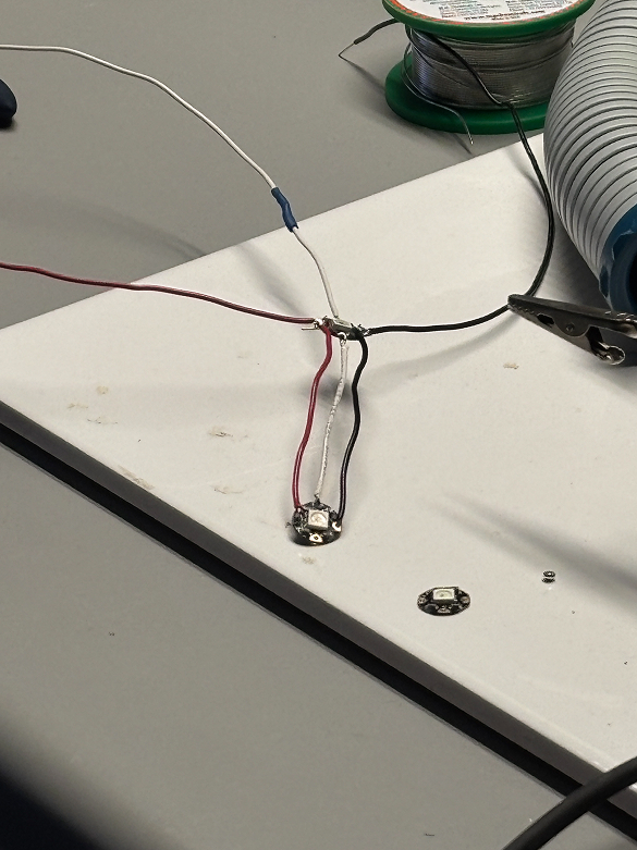 Clipping the wires onto the ’helping hands’ while we wait for the soldering iron to heat up